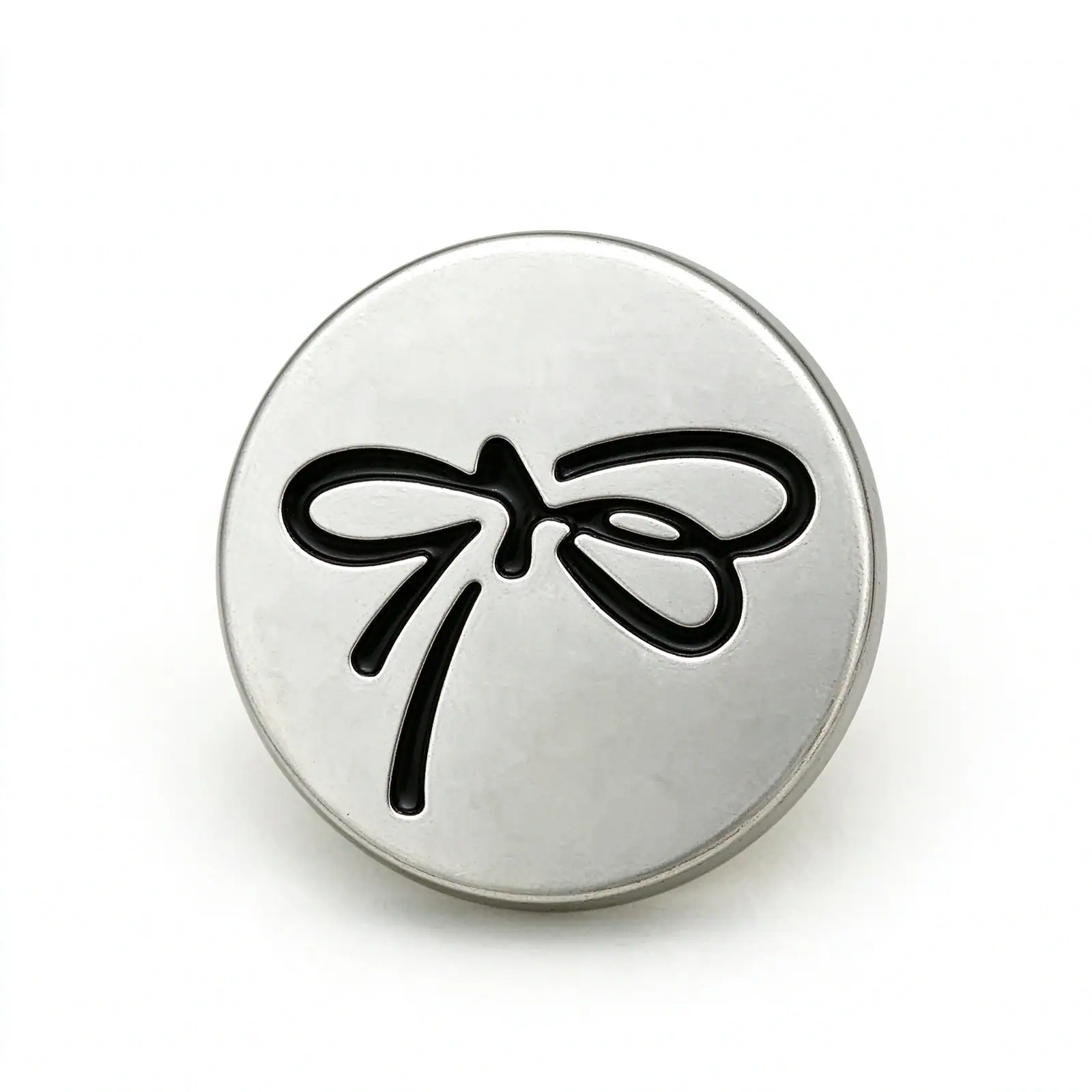 Three silver bow buttons with a matte silver-tone face and a raised ribbon bow outline in cream, black and pink