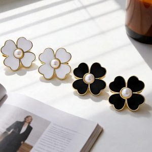 White and black flower-shaped pearl buttons with gold rims